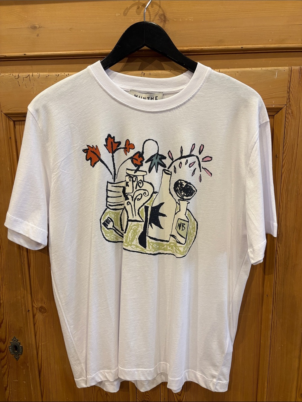 White Short-Sleeve Graphic Tee with Artistic Vase Illustration